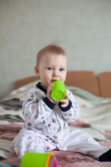 Baby playing with Multicolored shape sorter toy