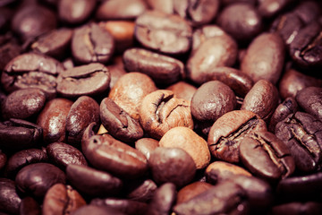 Coffee beans on grunge wooden background