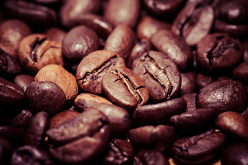 Coffee beans on grunge wooden background