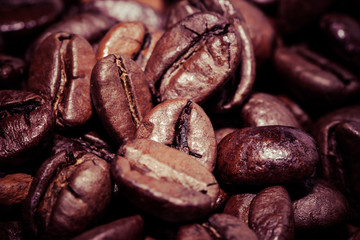 Coffee beans on grunge wooden background