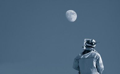 surveyor with instrument surveying the moon