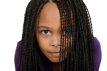 young black child with braids over face