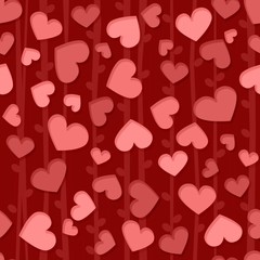 Seamless background pattern with red and pink hearts