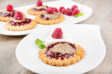 Delicious raspberry cake with mint and almond cream