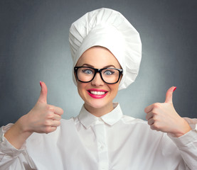 Happy woman cook chef showing thumbs up, close up