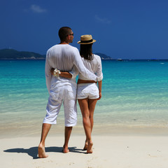 Couple in white on a beach