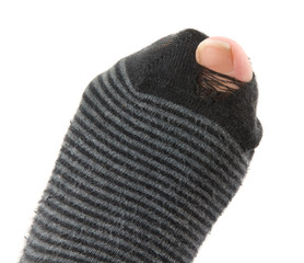 Close up image of a sock with a hole isolated on white