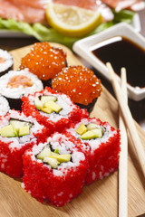 Rolls with tobiko, avocado and cucumber