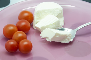 Fresh cheese with cherry tomatoes