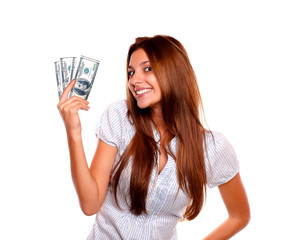 Happy young woman holding up cash money