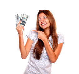 Smiling woman looking and pointing cash money