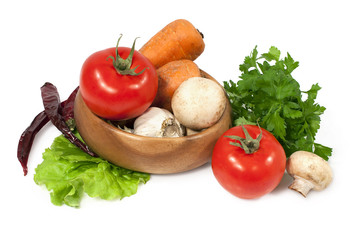 raw vegetables over white