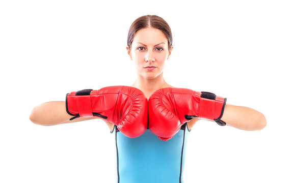 Pretty girl in boxing gloves pose, isolated on white