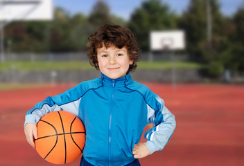 Adorable child playing the basketball