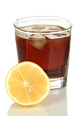 Glass of whiskey with ice and lemon isolated on white