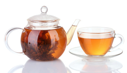 Exotic green tea with flowers in glass teapot isolated on white