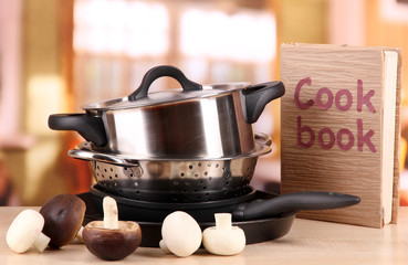 composition of kitchen tools and vegetables on table in kitchen