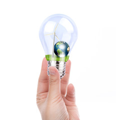 Hand holding light bulb with wind turbine and earth inside (Elem