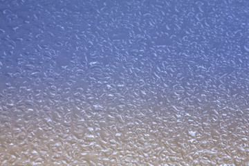 Red and blue glass droplets