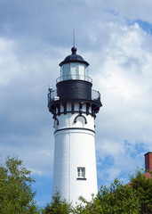 old  traditional lighthouse with cloudy sky © pyzata