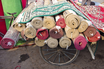 various carpets rolls in Delhi market, India