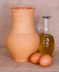 Egg, oil and pitcher