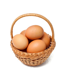 basket with fresh brown eggs