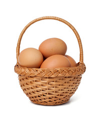 basket with fresh brown eggs