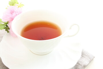 english black tea with flower on white background