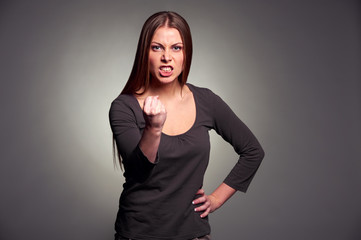 angry woman threatening the fist
