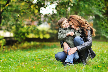 Happy mother and son portrait outdoors