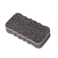 close up of chalks and eraser on white background