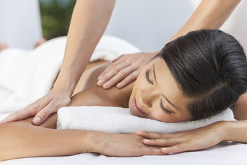 Fototapeta na wymiar Woman Relaxing At Health Spa Having Massage