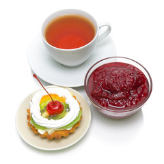 cake, jam and a cup of tea on a white background