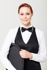 pretty young waitress with empty tray on white