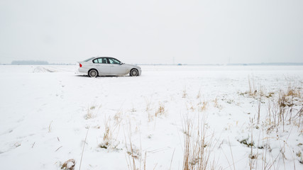 Car parked on a snowy road