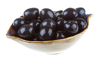 Olives black watered with olive oil in a bowl isolated on a whit