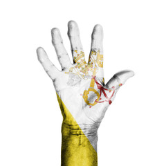 Hand of an old woman, wrapped with a pattern of the flag of the