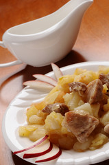 Fried potatoes with meat