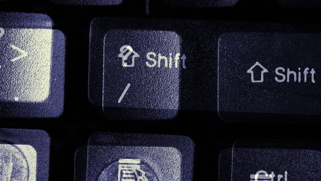 Sequences of a modern ergonomic computer keyboards in black.