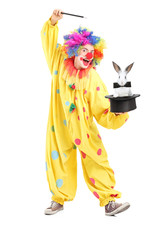 Circus clown performing a magic trick with a top hat and a rabbi