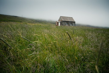 traditional small house in the middle of grassland