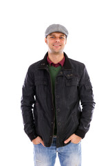 Fototapeta premium Portrait of happy handsome young man with hands in pockets