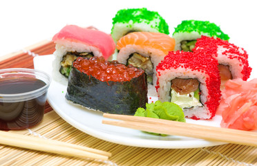 Traditional Japanese food. Different sushi rolls, wasabi and pic