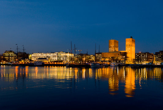 Oslo City Hall and harbour, twilight.