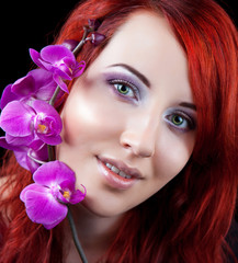 Beautiful Healthy Woman with Orchid flower