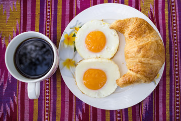 The breakfast on the patterned fabric.