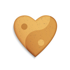 Gingerbread cookie in the shape of a heart with Yin Yang symbol