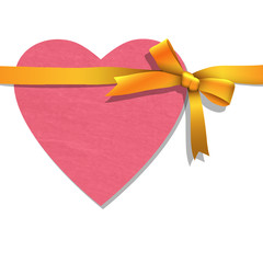 Paper heart with tied golden ribbon