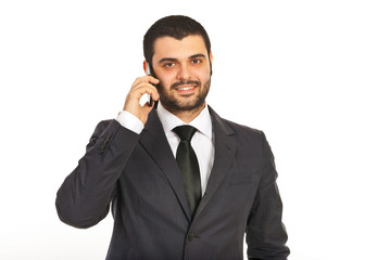 Smiling business man by cell phone